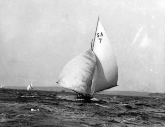 CARINA under spinnaker in a north-east sea breeze on Sydney Harbour, possibly racing in a Forst…