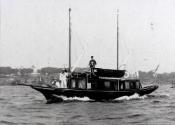 The vessel is one of the two identical tenders on davits seen in this image. They are being car…