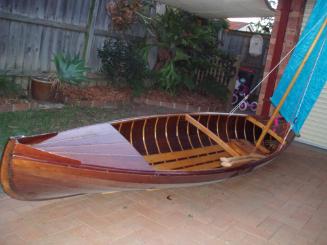 A general view of BOYONG showing the short  planked foredeck and open cockpit area with floorbo…