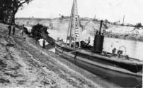 A very clear image of DART with its pile driving machinery set up for work, and moored beside t…