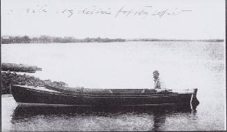 Gronfors at the tiller of ILMA JEAN which he built.
