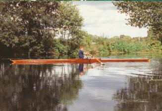 KINGFISH being sculled by the owners son in about 2000 after being refitted with new riggers, s…